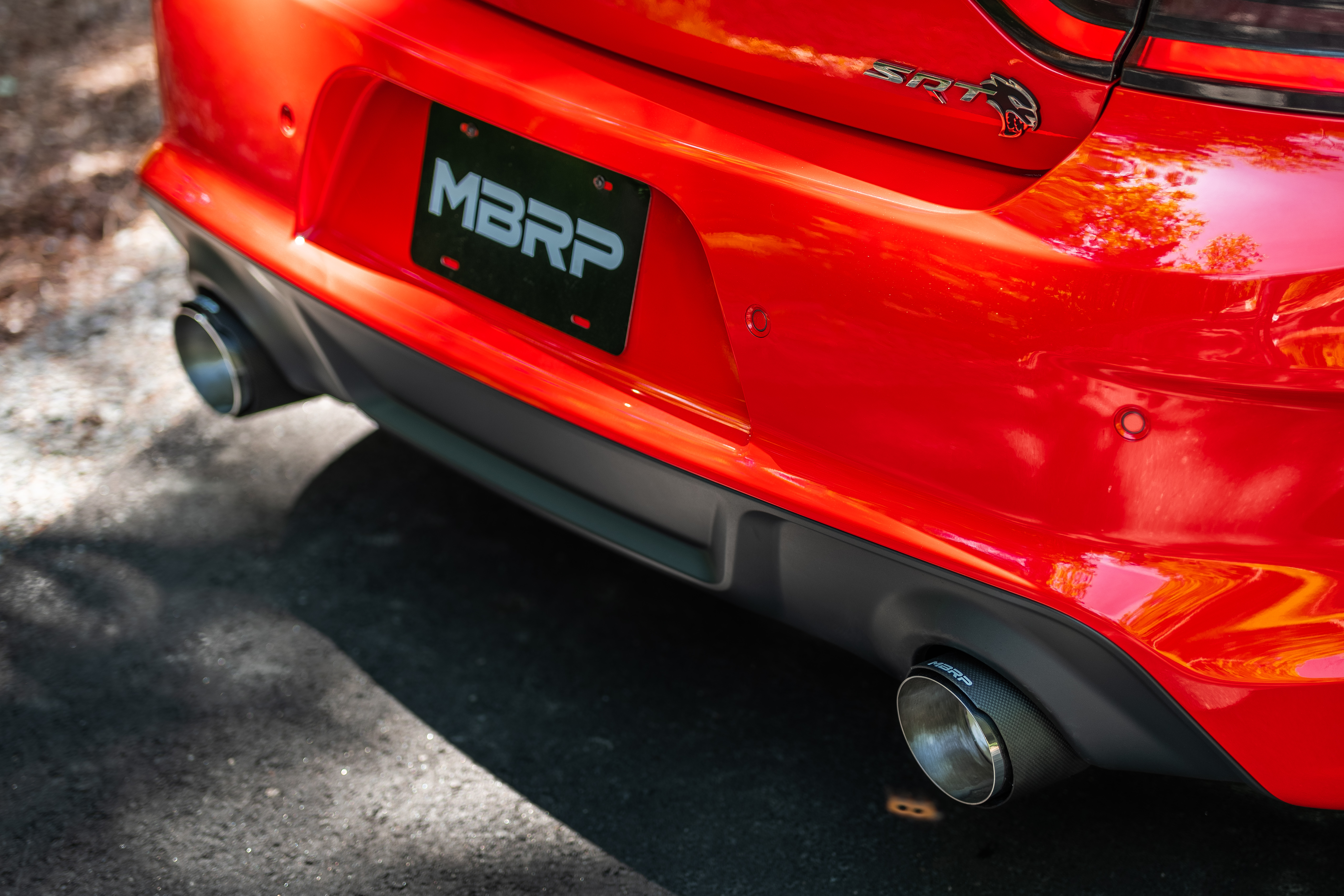 back of a Dodge Charger looking at the exhaust tips