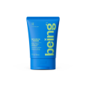 A tiny blue bottle of 'being' Nourish + Shine Daily Clean Conditioner with Shea Butter and Aloe Extract.