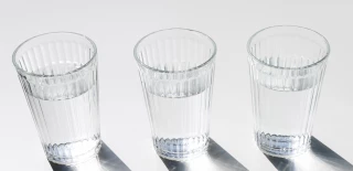 water-glasses-with-dark-shiny-shadow-white-backdro...