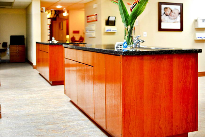 Modern reception area with wooden counters.