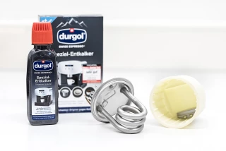 Coffee machine heating element before and after descaling Coffee machine heating element before and after de...