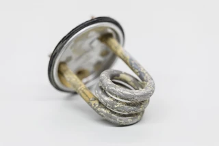 Coffee machine heating element before and after descaling Coffee machine heating element before and after de...