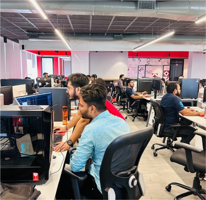 ZURU office floor in India office, multiple desks with employees working